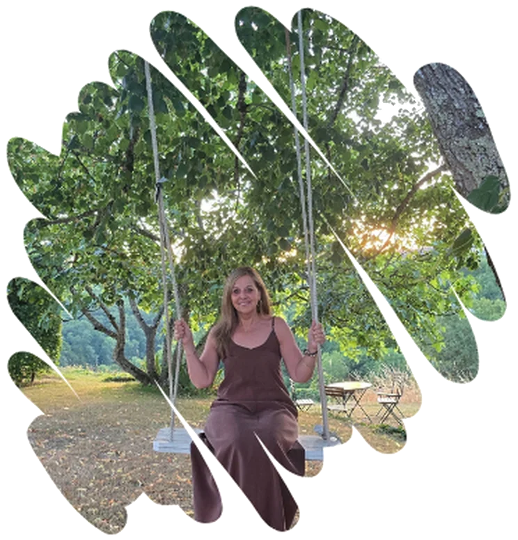 Mieke Meyfroidt on a swing under a tree